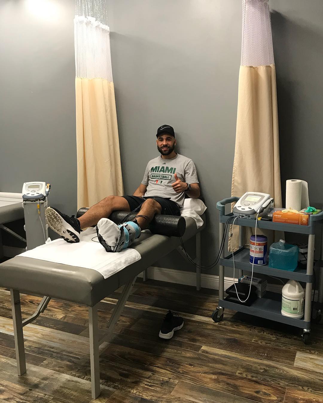 Patient receiving lower-leg therapy on a treatment table at Instinct Health Care