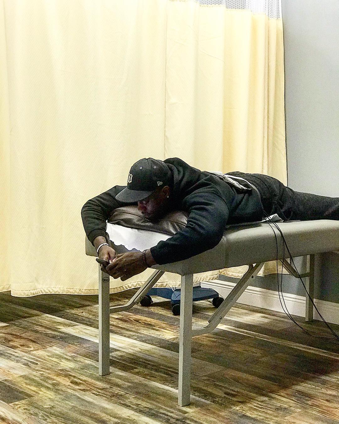 Patient receiving chiropractic treatment on a therapy table in a private care room